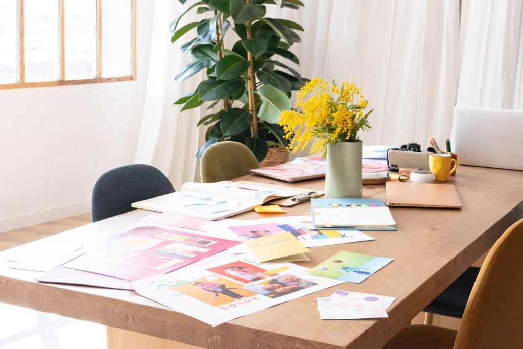 Flat lay of branding materials and moodboard on desk – brand strategy and design service
